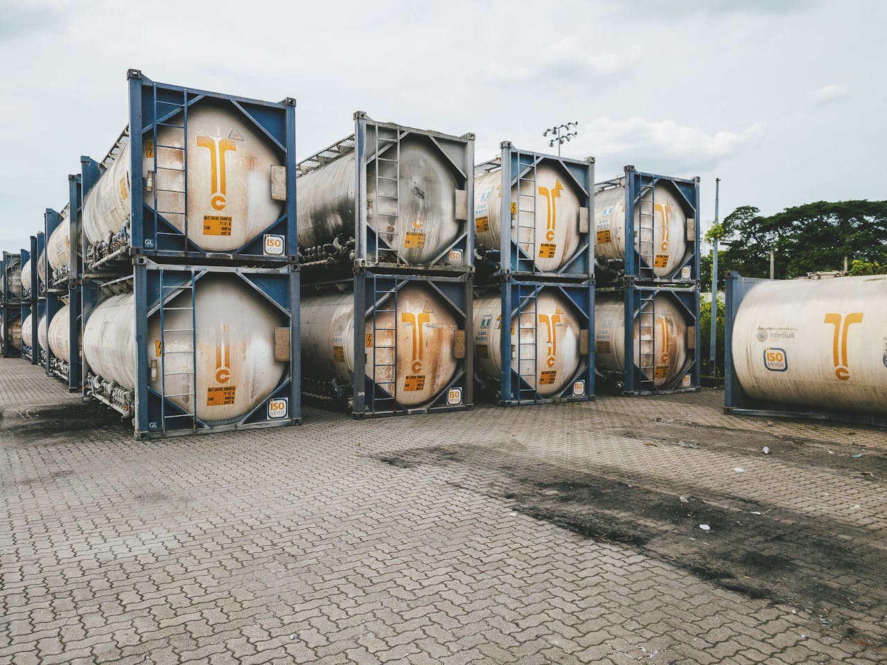 Industrial scene of tank containers stacked at Ipoh port, Malaysia.